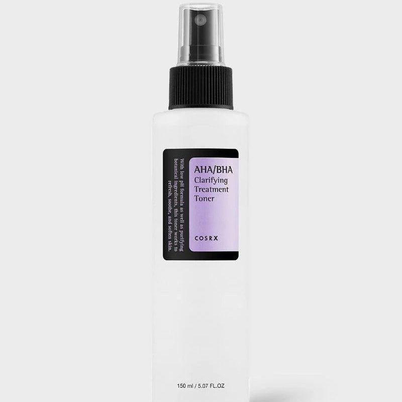 Skincare bottle with black spray nozzle and purple label on a white background