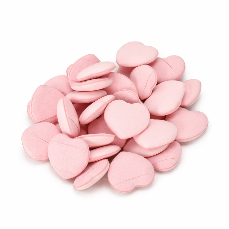 Pink heart-shaped candies on a white background