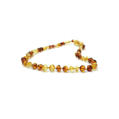 Amber teething necklace on a white background