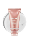 Pink tube of Medicube product on a white background