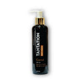 A bottle of carrot tanning oil placed on a sandy beach, with golden sunlight reflecting off the surface