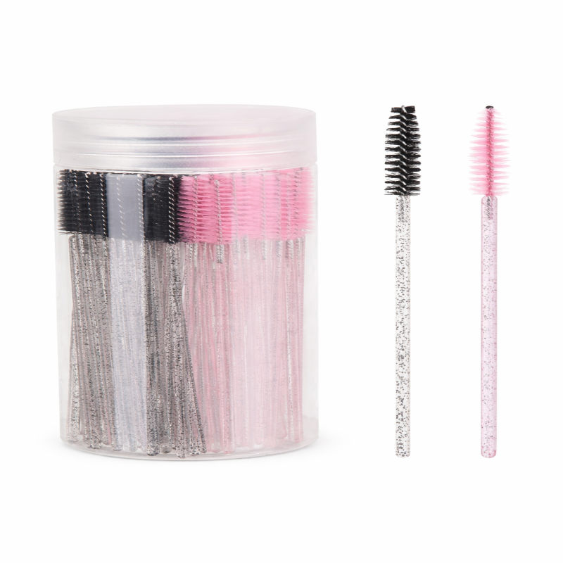 Set of false eyelashes in a clear container with two lashes displayed in front on a white background