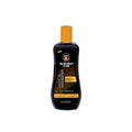Australian Gold tanning oil bottle on a white background