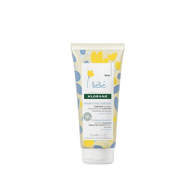 Klorane Baby Detangling Gentle Shampoo (200 ml white tube with yellow calendula accents) shown from front, side label, back, and botanical illustration.