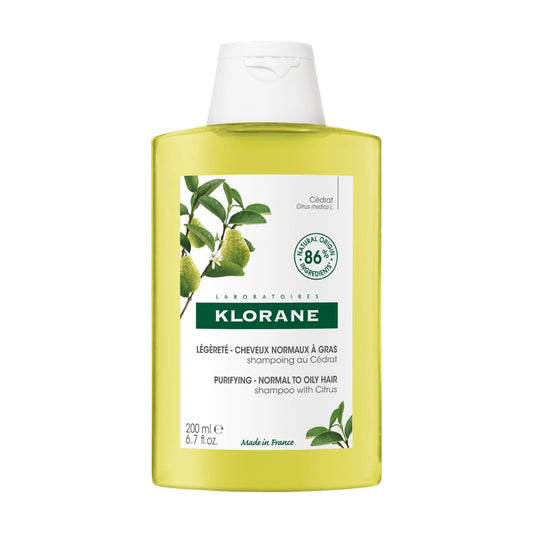 Klorane shampoo bottle with green label on a white background