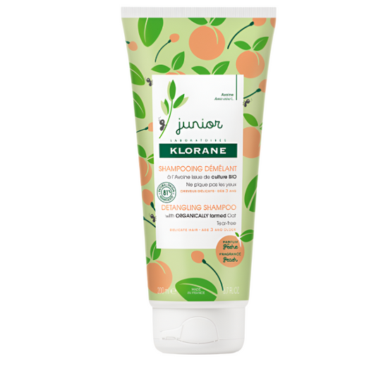 Klorane Junior detangling shampoo tube with peach and leaf design on a white background