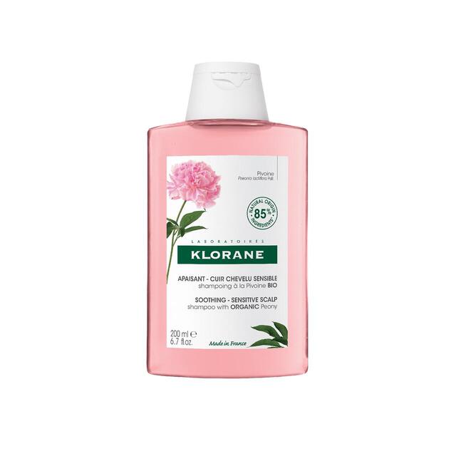 Klorane shampoo bottle with pink label and white cap on a white background