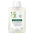 Klorane Oat Milk Shampoo bottle, featuring branding and oat botanical design.