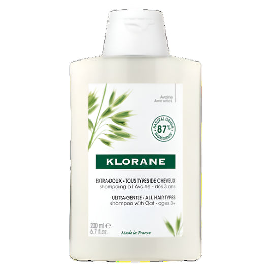Klorane Oat Milk Shampoo bottle, featuring branding and oat botanical design.