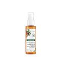 Klorane hair care product bottle on a white background